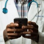 A doctor using mobile